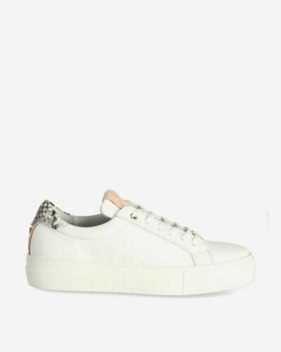 White sneaker with snake patch